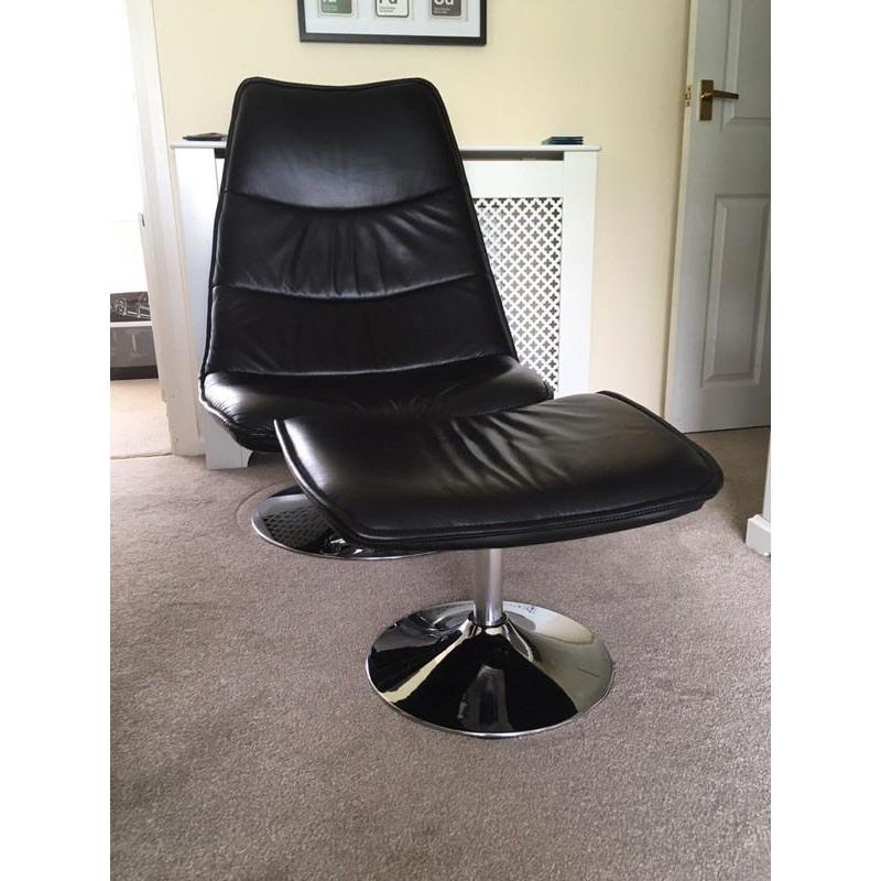 Black leather and chrome effect chair with foot stool