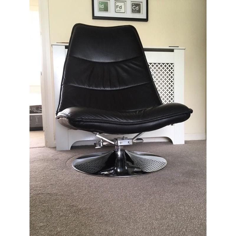 Black leather and chrome effect chair with foot stool