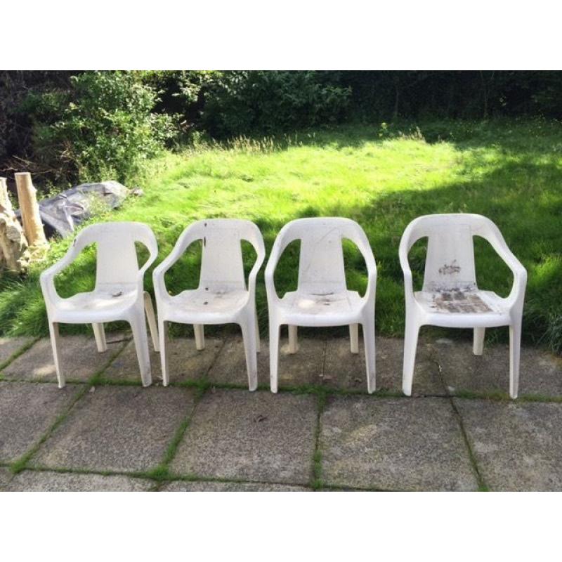 Set of four white garden chairs