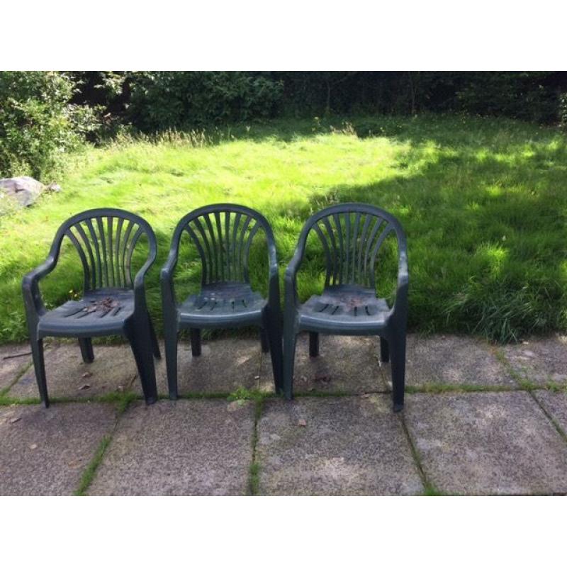 Set of three green garden chairs