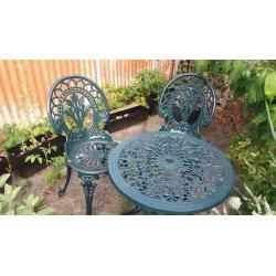 A table with a pair of metal garden set - perfect for breakfast in your patio