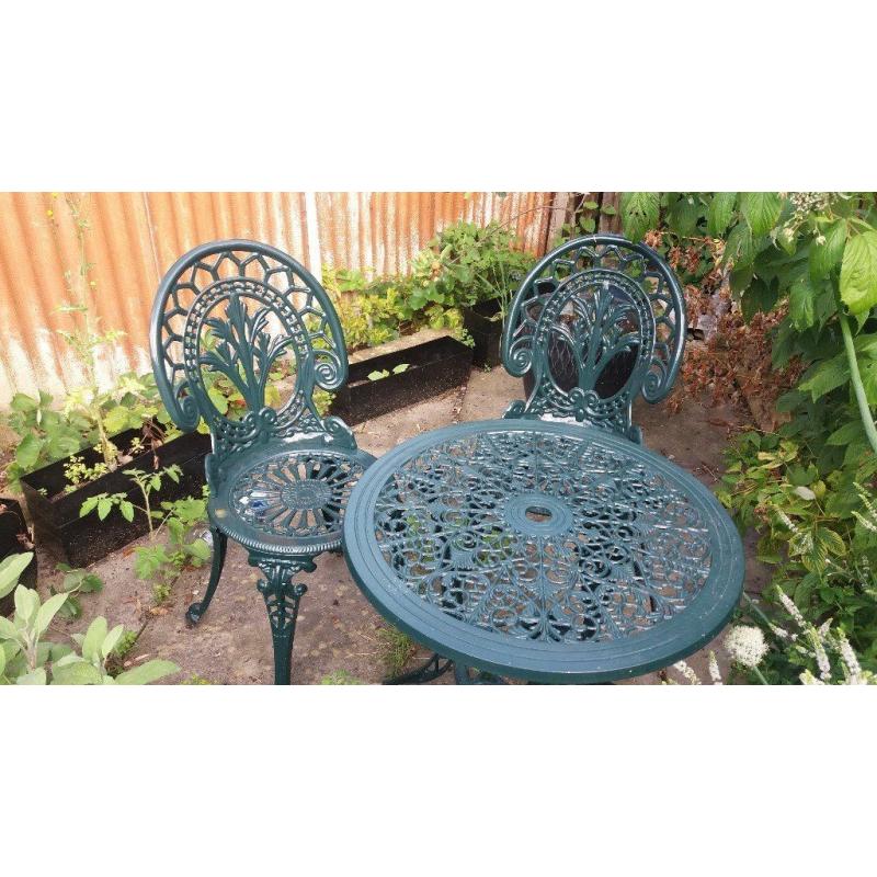 A table with a pair of metal garden set - perfect for breakfast in your patio