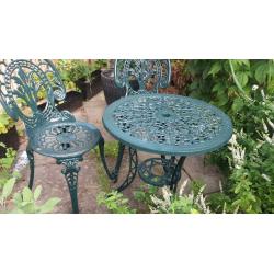 A table with a pair of metal garden set - perfect for breakfast in your patio