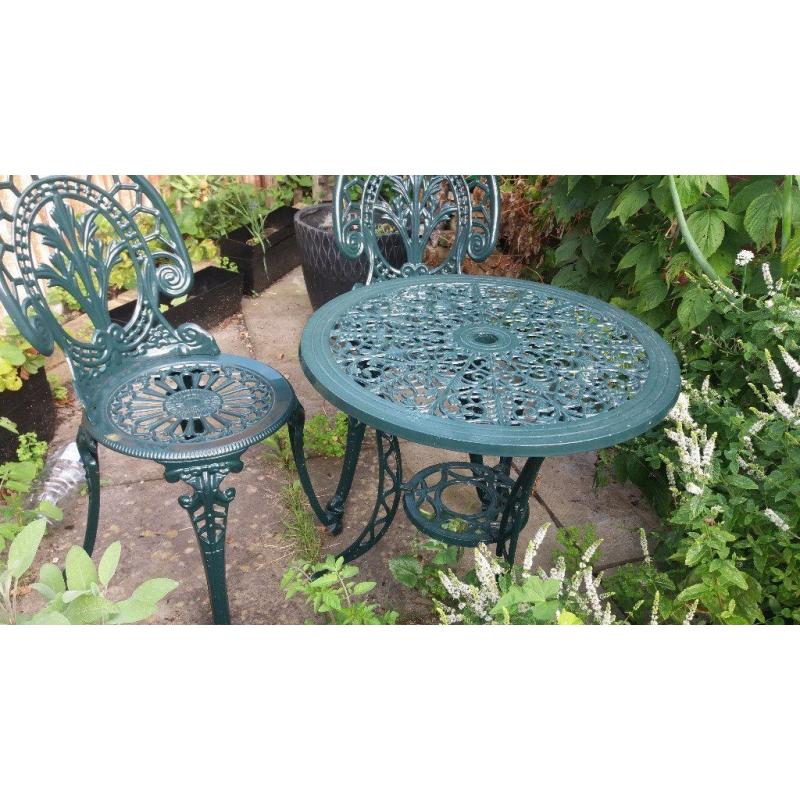 A table with a pair of metal garden set - perfect for breakfast in your patio