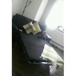 Leather three seater bed settee