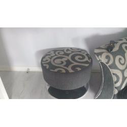 2 grey sofas with footstool