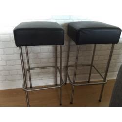 Two Ikeas faux leather bar stools