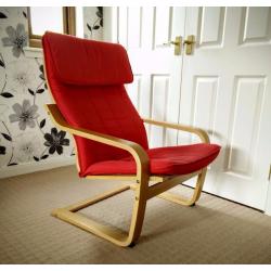 Red Ikea Poang chair and stool