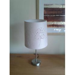 Table lamp with cutout shade