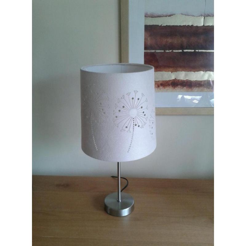 Table lamp with cutout shade