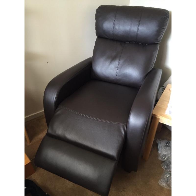 Pair or leather, brown reclining armchairs