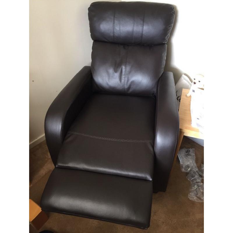 Pair or leather, brown reclining armchairs