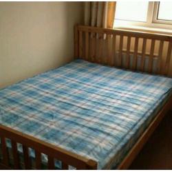 Double wooden bed and mattress