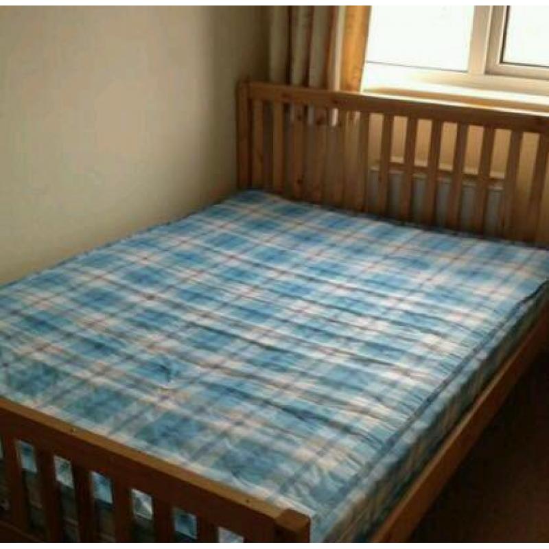 Double wooden bed and mattress