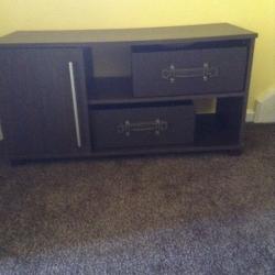 Brown TV stand with cupboard