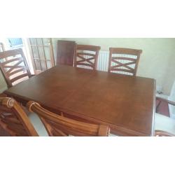 Mahogany effect dining table and six chairs