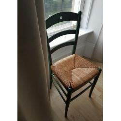 Wicker chair with green frame