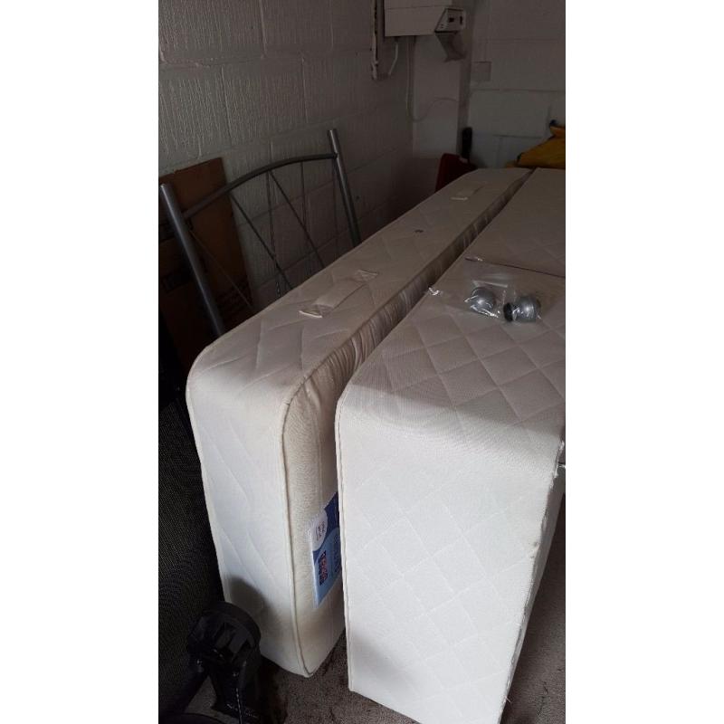 Single bed with mattress and silver headboard