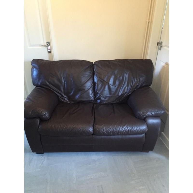 2 seater brown leather sofa.