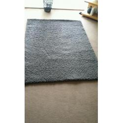 Large shaggy brown rug