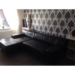 Large leather black corner sofa