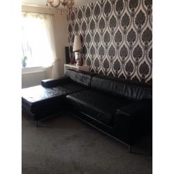 Large leather black corner sofa