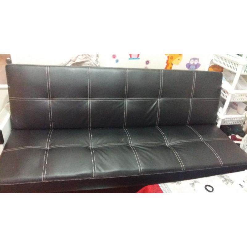 three seated Faux Leather black Sofa bed nearly new