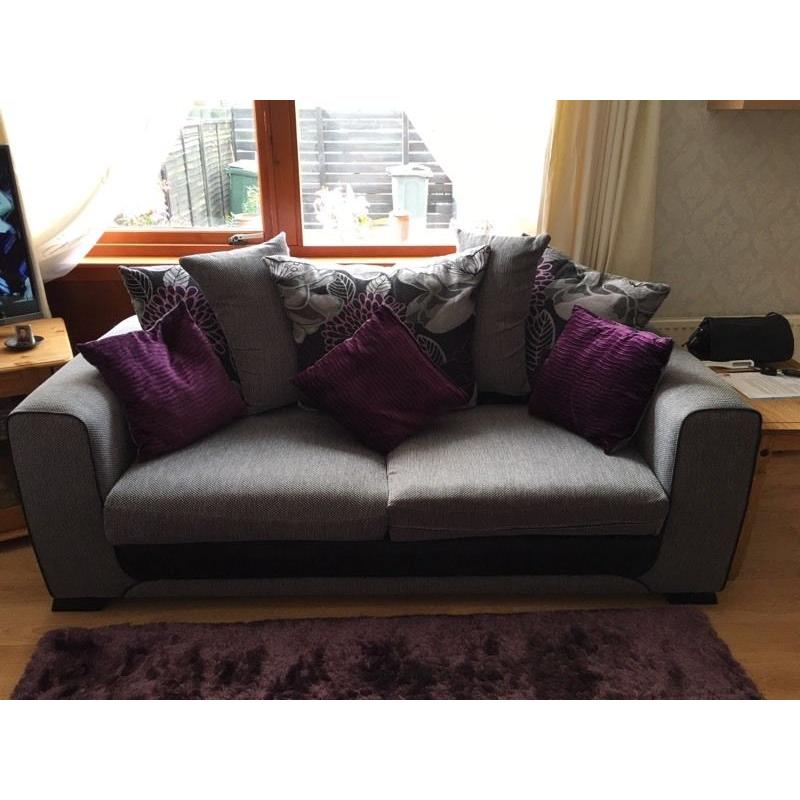 Light grey sofa/couch with grey chair and large stool