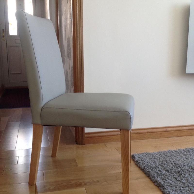 4 Biege Dining chairs for sale immaculate condition Faux leather.