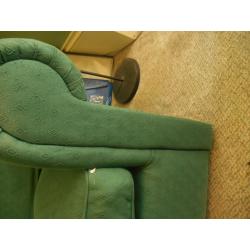 Green cotton sofa, free. Worn but serviceable. Feather cushions. Buyer to collect