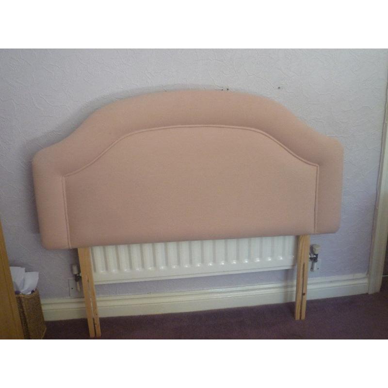 A neutral coloured fabric headboard suitable for a small double bed (4 ft)