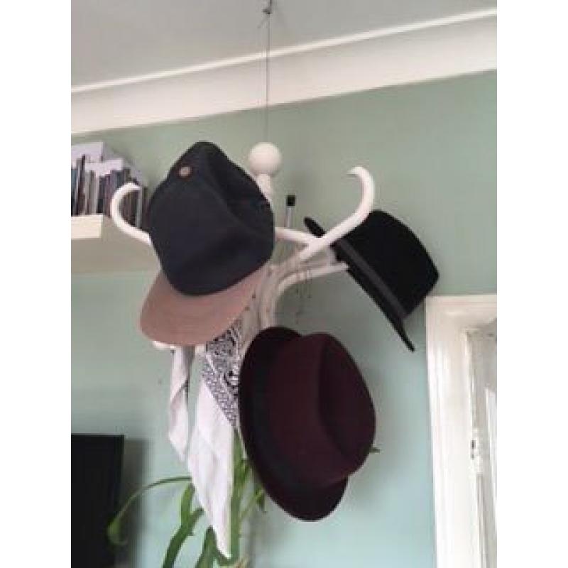 Suspended hat stand.