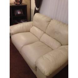 2 cream two seater couches with footstool