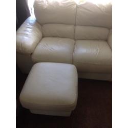 2 cream two seater couches with footstool