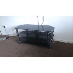 Black glass and chrome legged tv stand