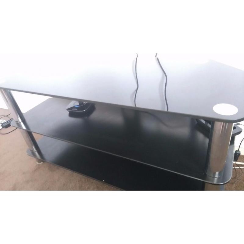 Black glass and chrome legged tv stand