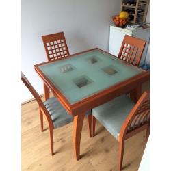 Glass top, wooden legs extendable dining table and 6 chairs