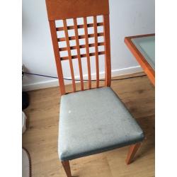 Glass top, wooden legs extendable dining table and 6 chairs