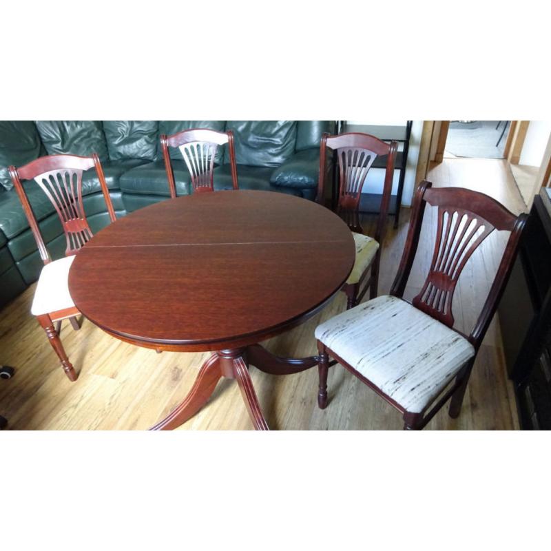 Extendable dining table and four chairs